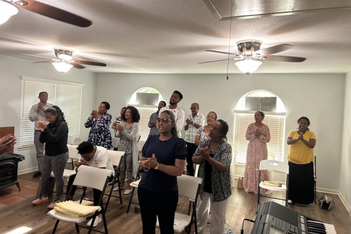 Church members standing in prayer